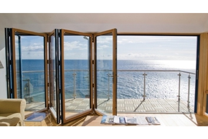 timber bi-fold doors leading out to a balcony