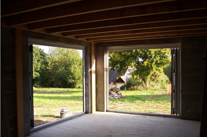Internal image of white upvc folding doors supplied to a customer in France.
