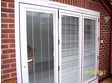 White upvc bifold door with blinds