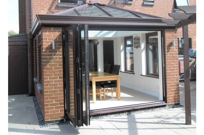 Brown 3 panel aluminium bifold door fitted to a Livin Room style conservatory also supplied by us.



Brown 3 panel aluminium bifold door fitted to a Livin Room style conservatory also supplied by us.


